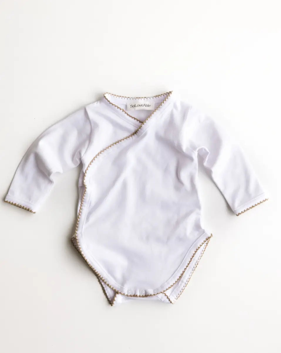 Soloveable baby bodysuit with crochet trim in brown organic cotton