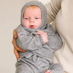 Baby wearing soft heather grey cashmere balaclava, warm knitted hood for infants.