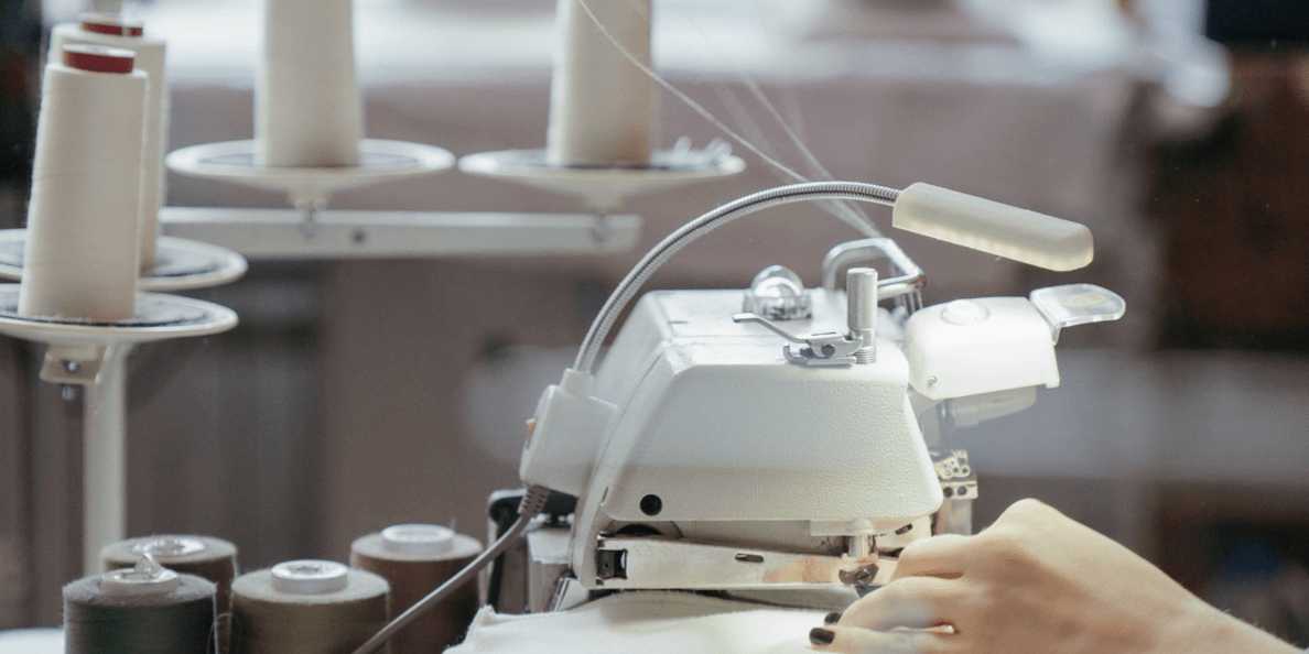 Sewing sustainable clothing – manufacturer producing eco-friendly, high-quality garments under fair working conditions.