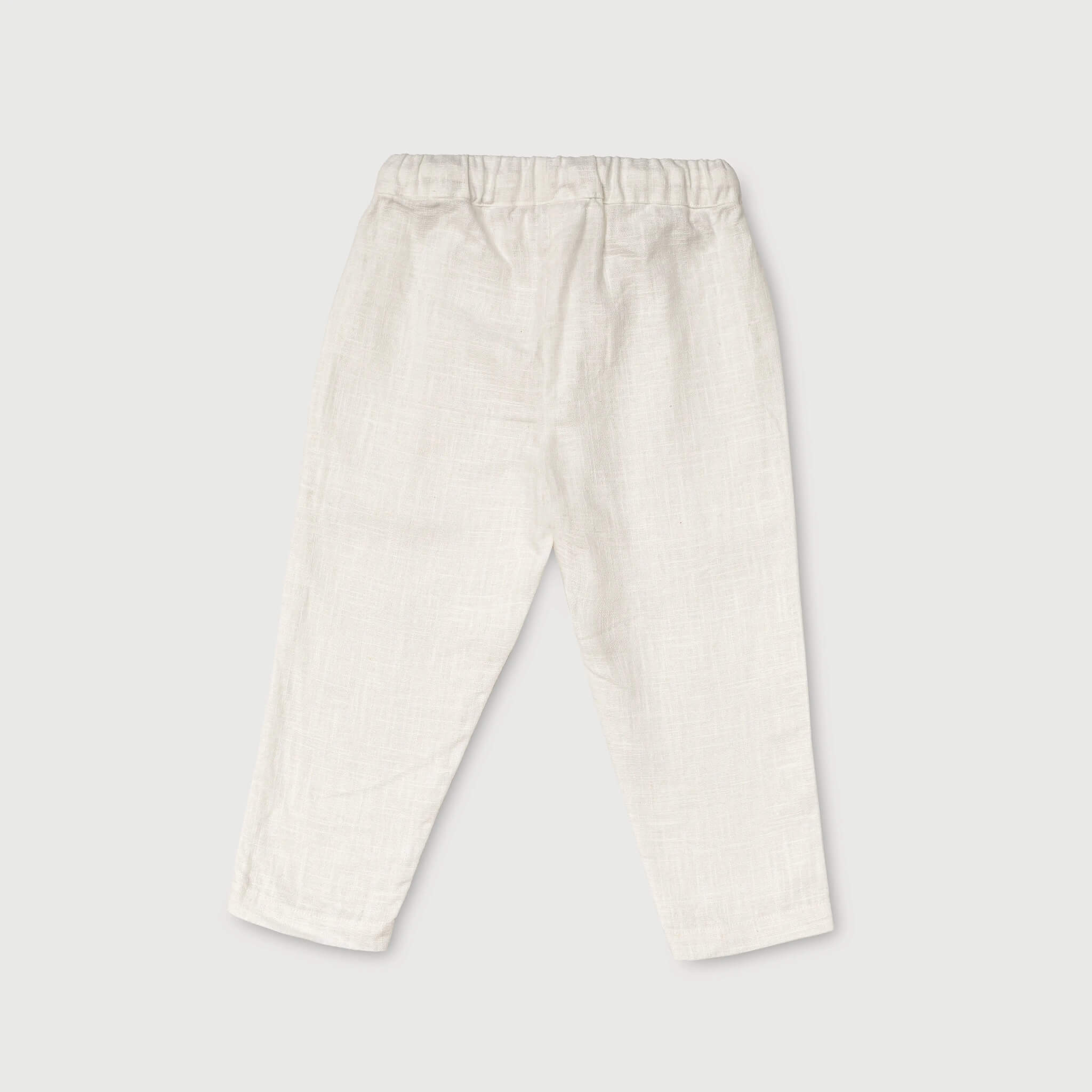Back view of lightweight white linen pants for babies and toddlers.