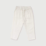Front view of white linen pants for babies and toddlers with elastic waistband and drawstring.