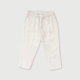 Front view of white linen pants for babies and toddlers with elastic waistband and drawstring.