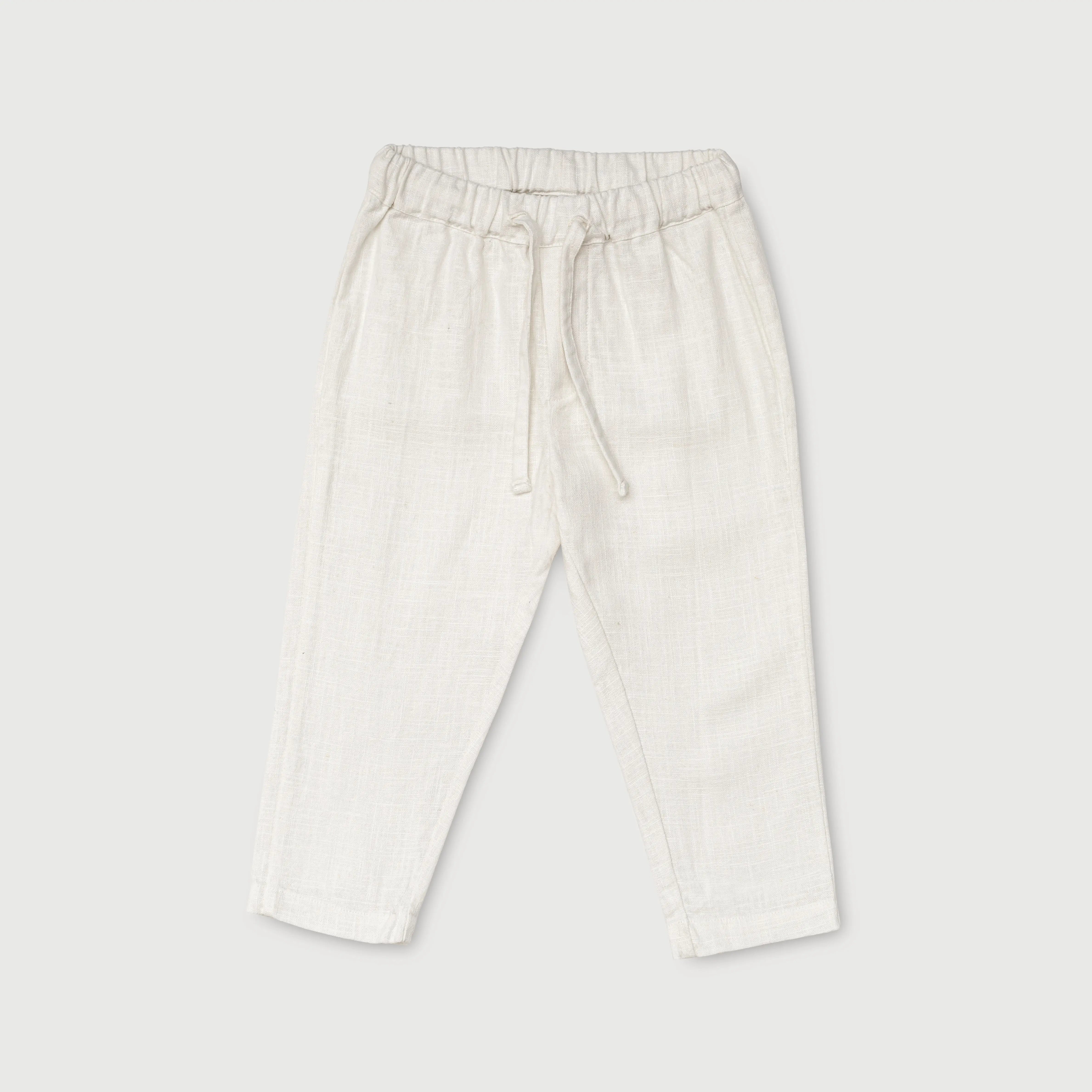 Long linen pants in white for baby and child - front view