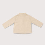 Back view of lightweight long-sleeve beige linen shirt for babies and toddlers.