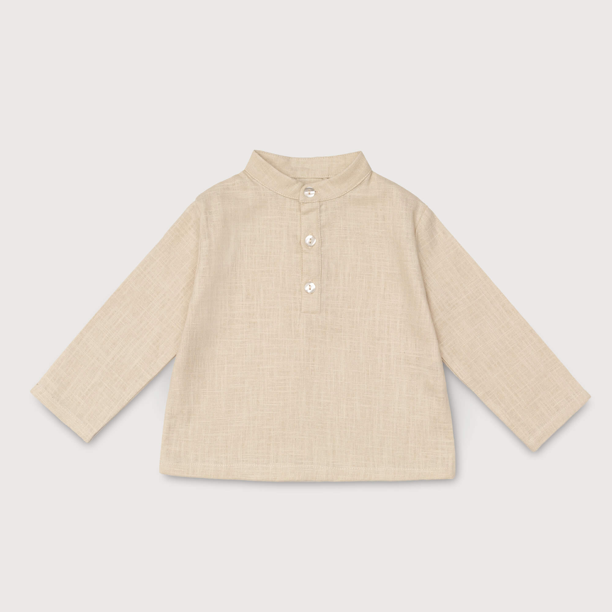 Front view of long-sleeve beige linen shirt for babies and toddlers with a collarless design and three-button placket.