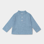 Front view of long-sleeve blue linen shirt for babies and toddlers with a collarless design and three-button placket.