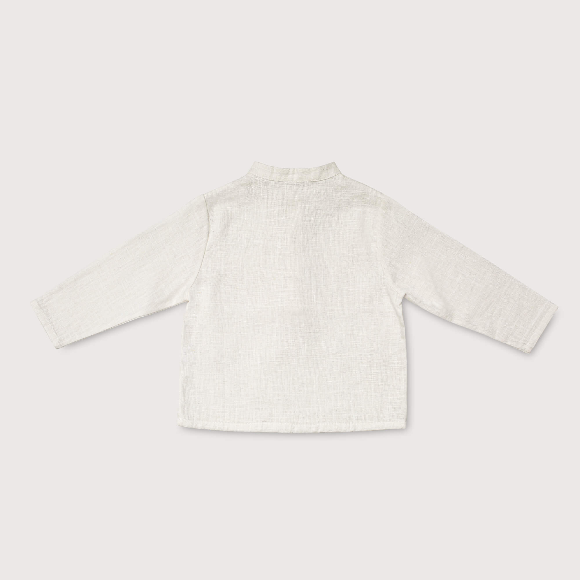 Back view of lightweight long-sleeve white linen shirt for babies and toddlers.