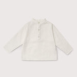 Front view of long-sleeve white linen shirt for babies and toddlers with a collarless design and three-button placket.