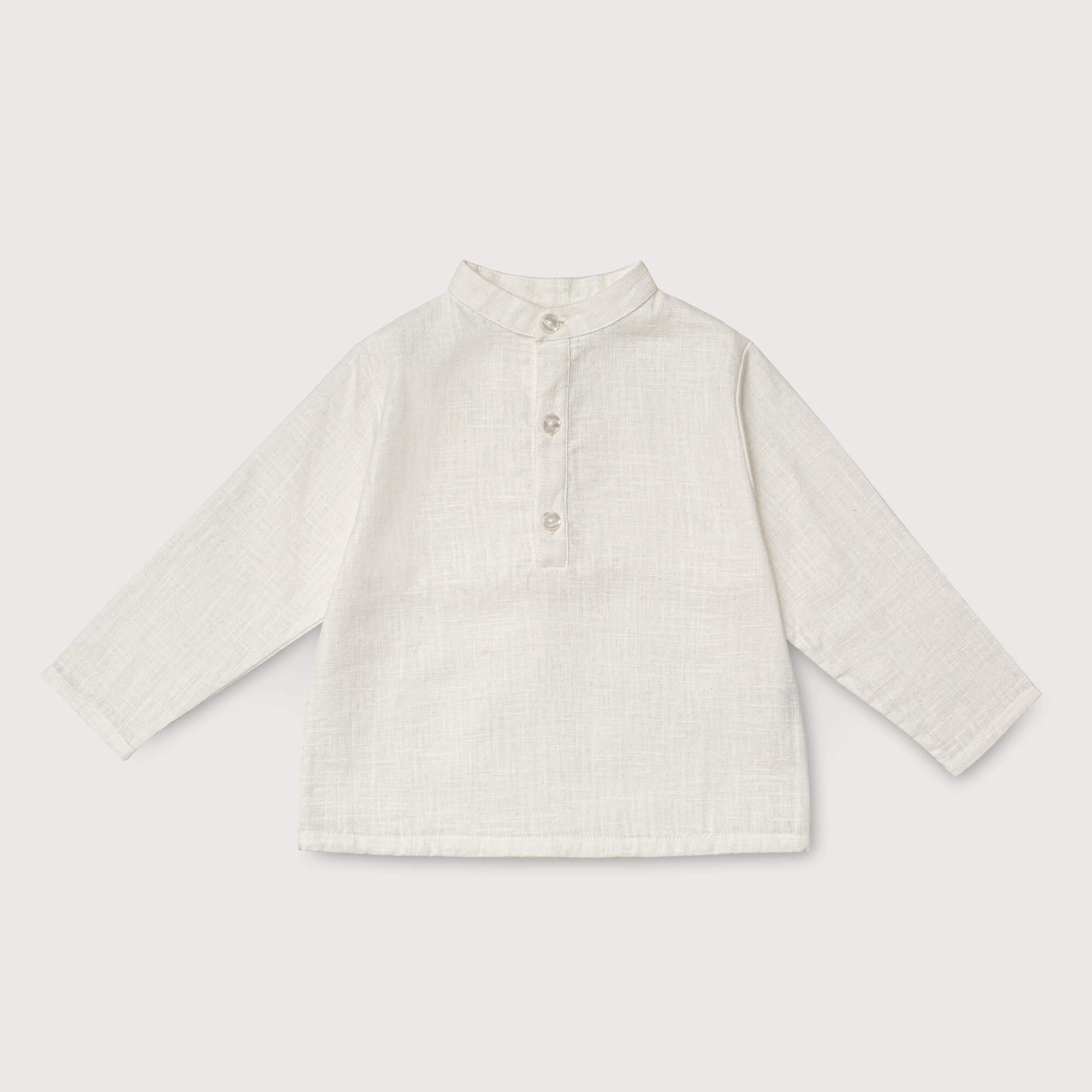Front view of long-sleeve white linen shirt for babies and toddlers with a collarless design and three-button placket.