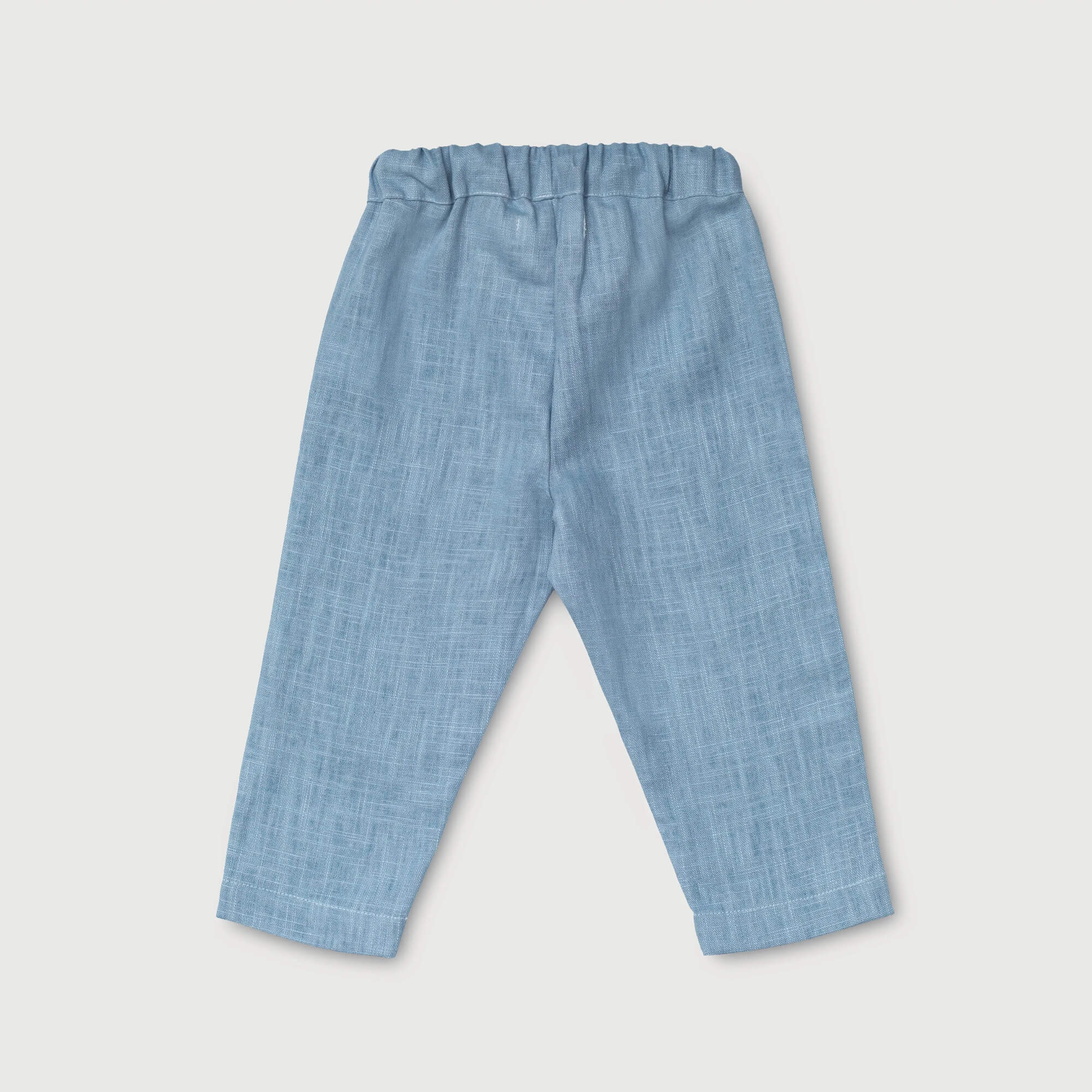 Back view of lightweight blue linen pants for babies and toddlers.