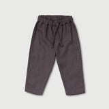 Front view of long brown linen pants for babies and toddlers with elastic waistband and drawstring.
