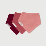Soloveable muslin baby bandana bibs in pink, red, burgundy displayed as a 3-pack.