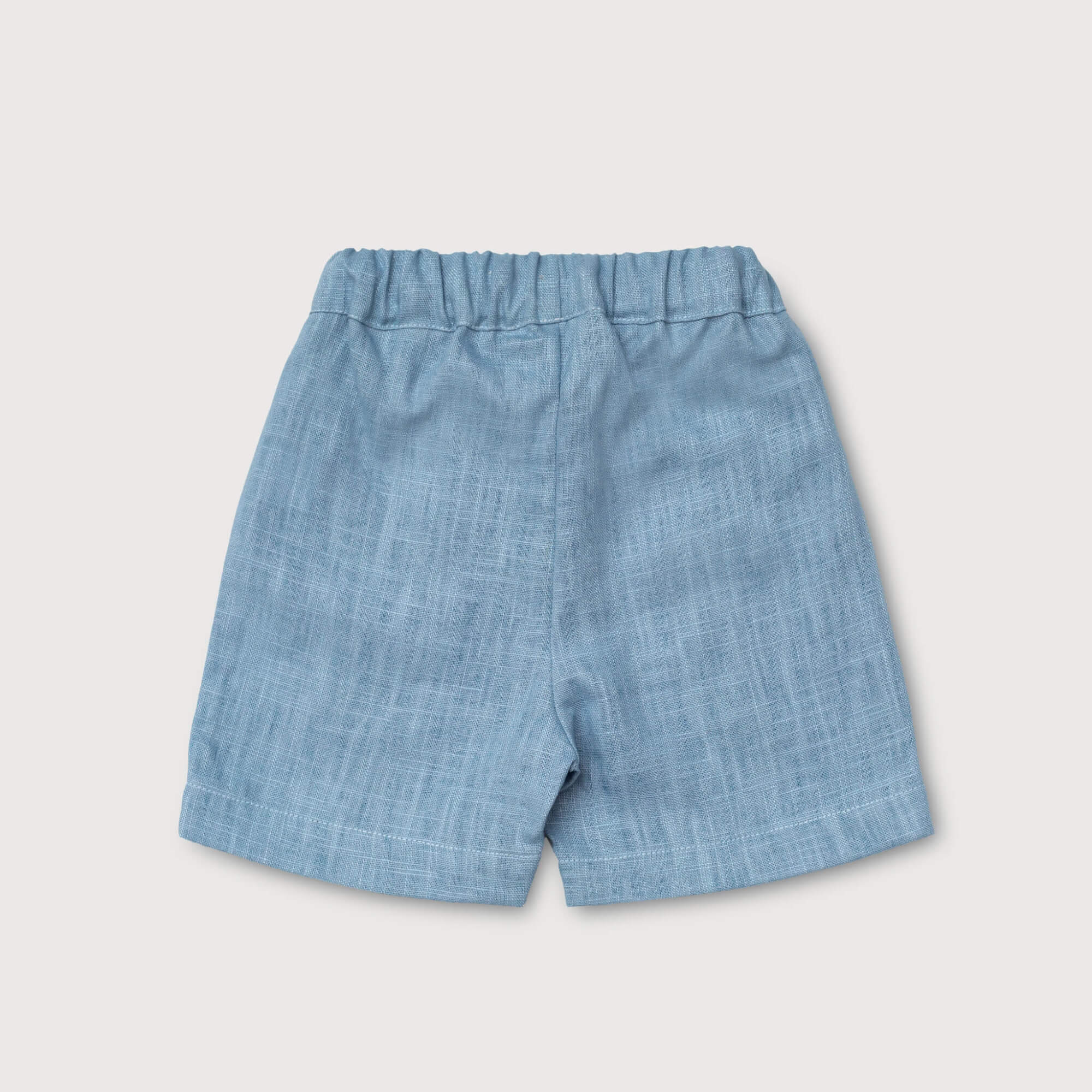 Back view of lightweight short blue linen pants for babies and toddlers.