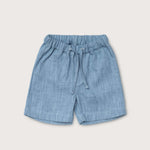 Front view of short blue linen pants for babies and toddlers with elastic waistband and drawstring.