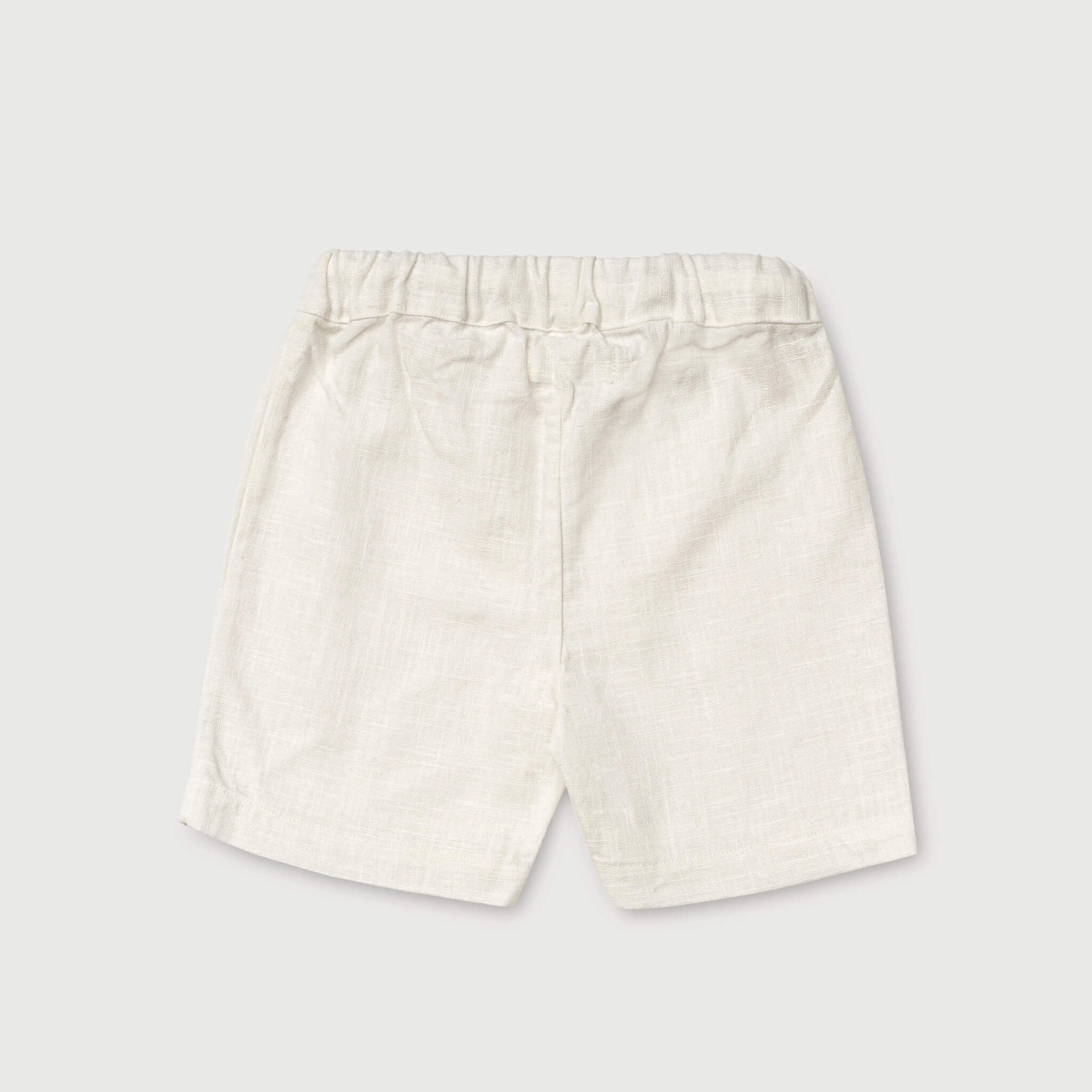 Back view of lightweight short white linen pants for babies and toddlers.
