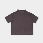 Back view of a lightweight brown linen short-sleeve shirt for babies and toddlers.