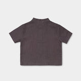 Back view of a lightweight brown linen short-sleeve shirt for babies and toddlers.