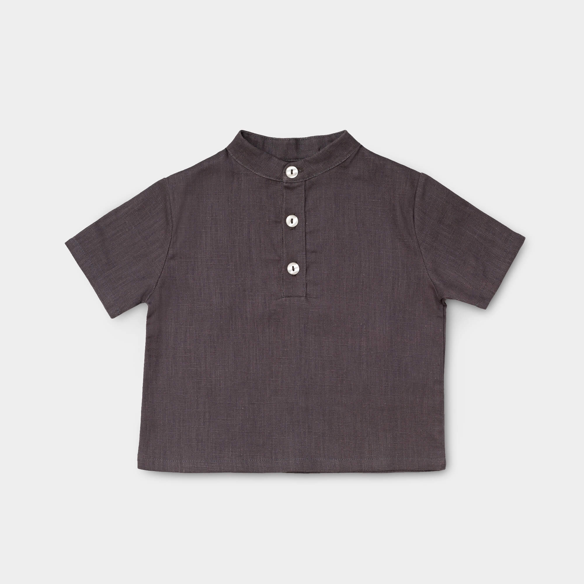 Front view of a short-sleeve brown linen shirt for babies and toddlers with a three-button placket.