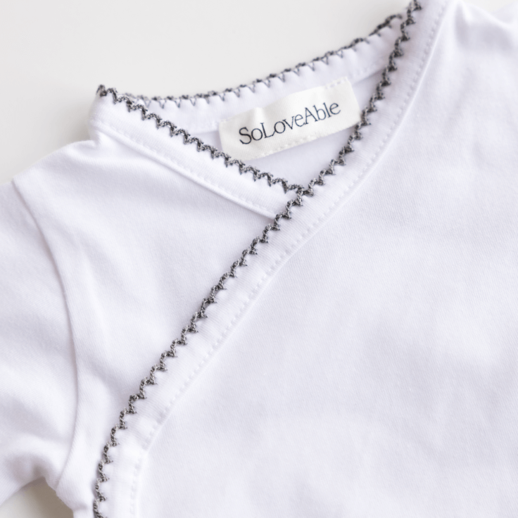 Close-up of soft organic cotton baby clothing from SoLoveAble, highlighting the quality and benefits of organic cotton.