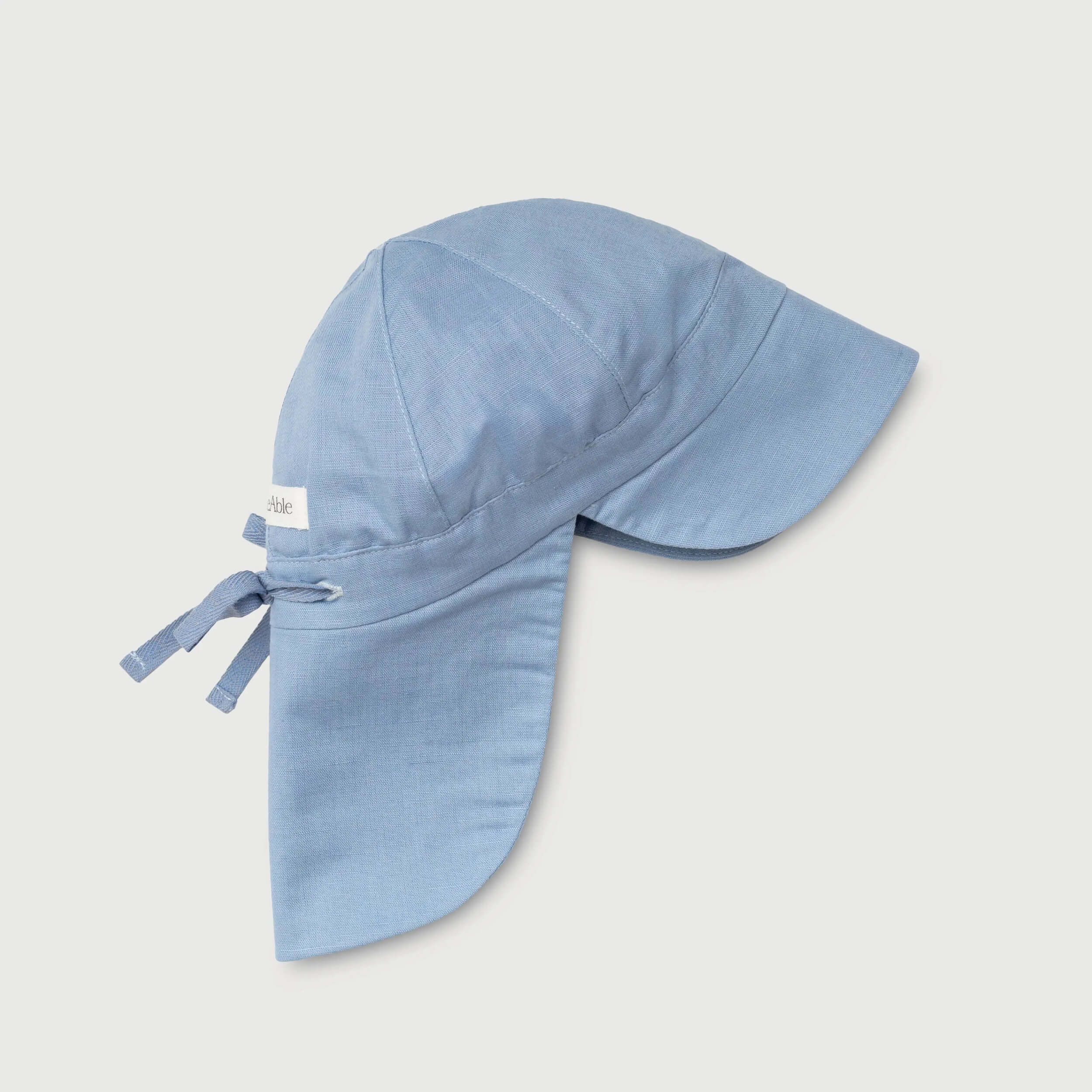 Blue linen sun hat for babies and toddlers with neck protection and adjustable tie, side view
