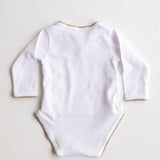 Back view of white baby bodysuit with caramel brown crochet trim.