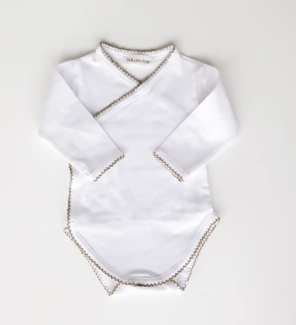 Baby bodysuit in white with sage green crochet trim, front view.
