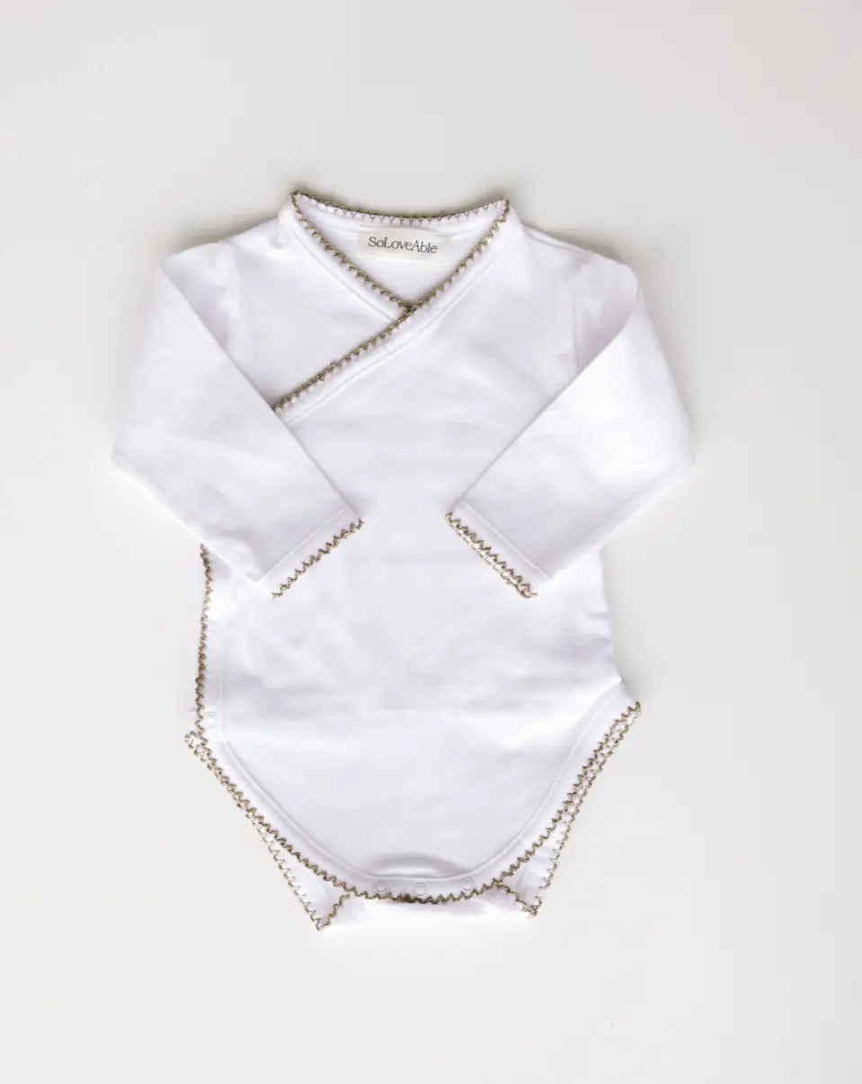 Baby bodysuit in white with sage green crochet trim, front view.
