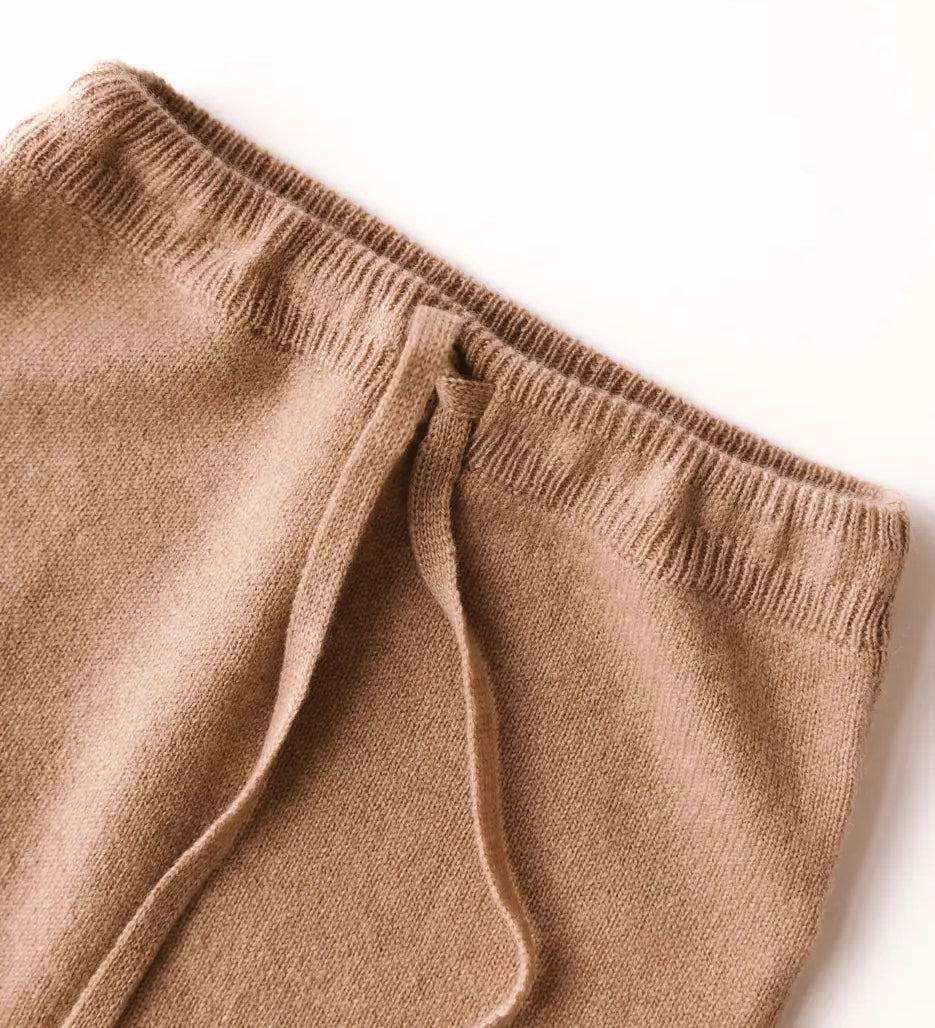 Close-up of waistband on caramel brown baby cashmere pants