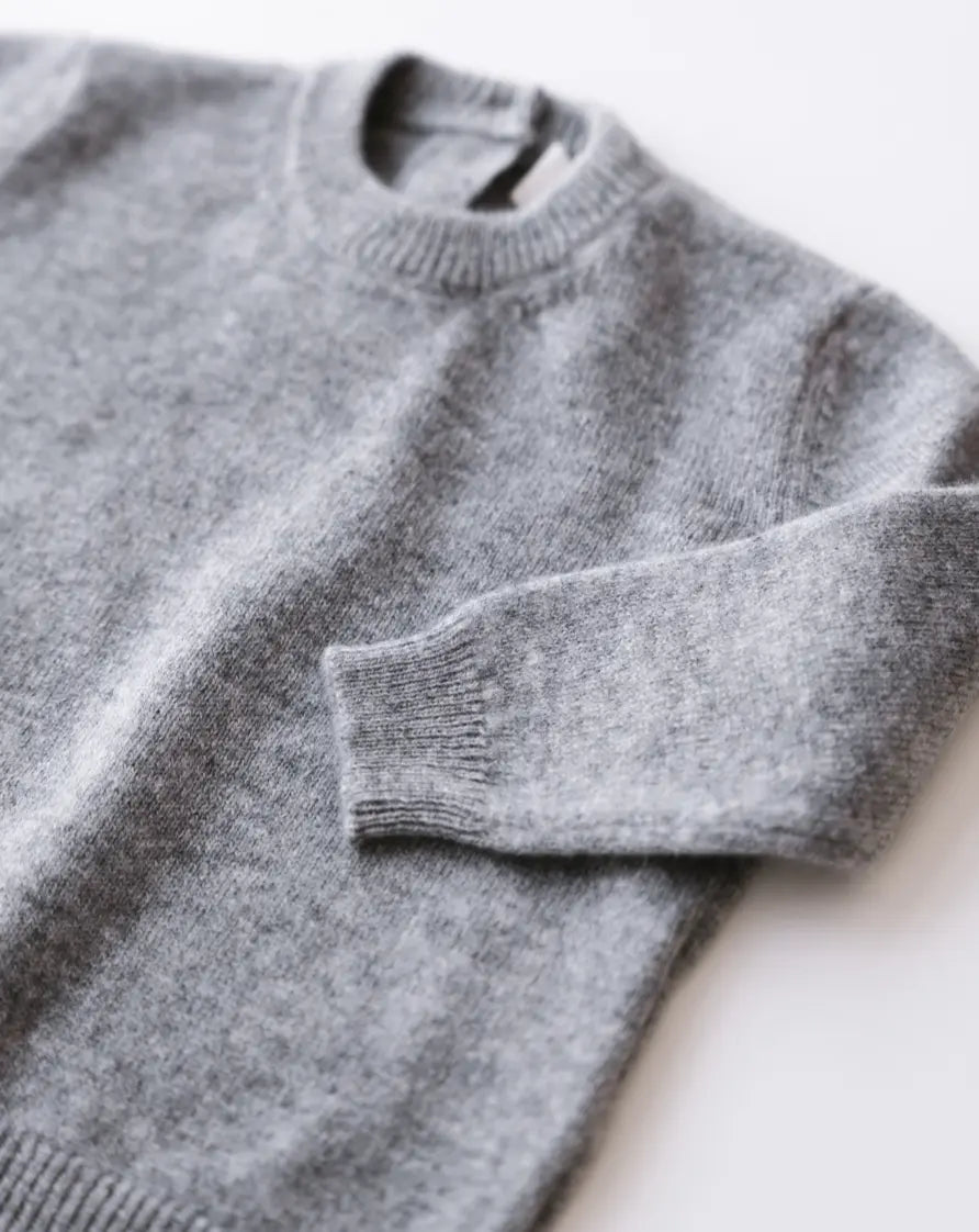 Close-up knit texture of heather grey baby cashmere sweater