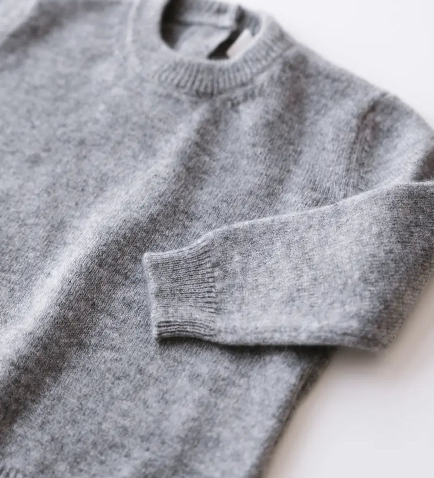 Close-up knit texture of heather grey baby cashmere sweater