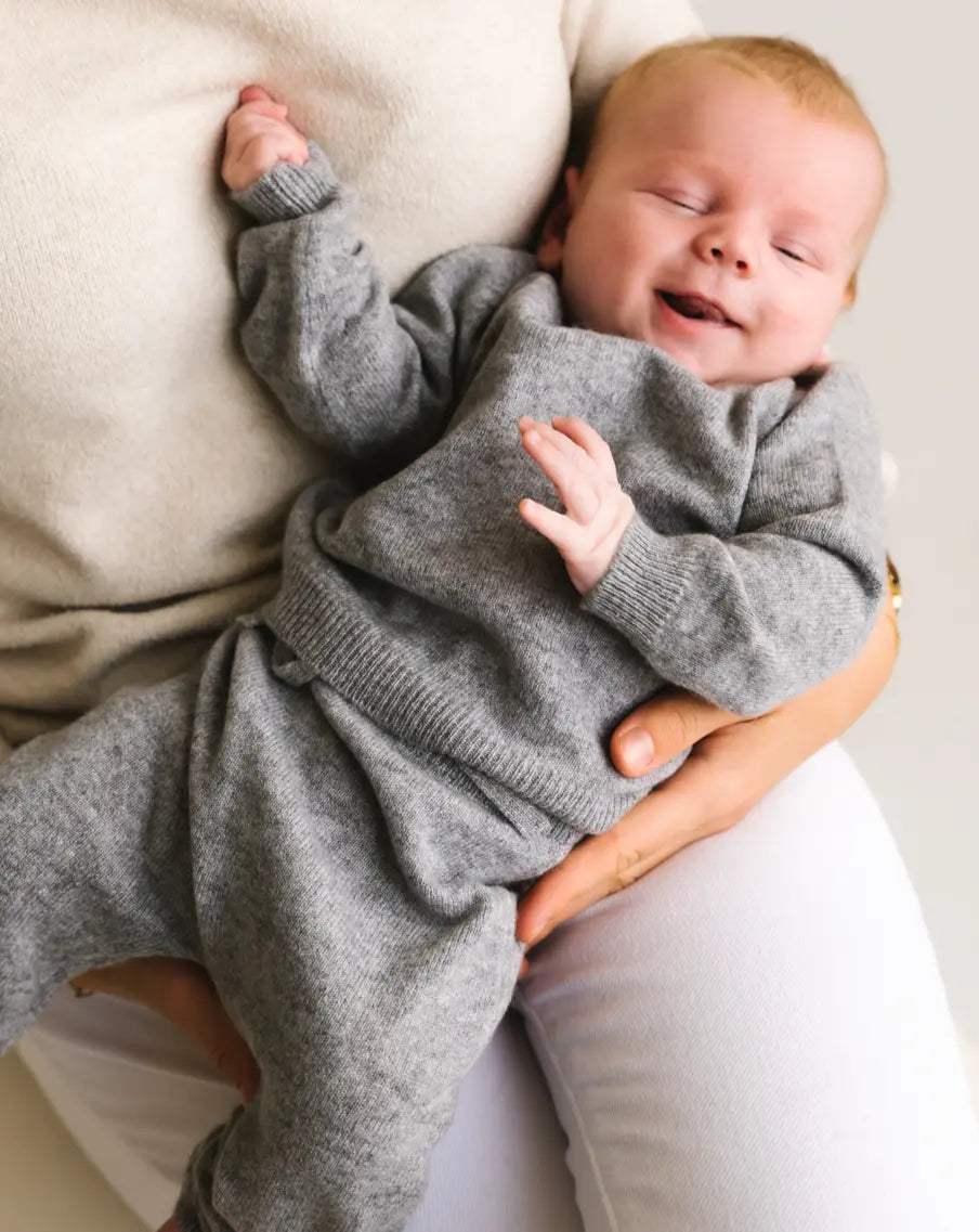 Baby wearing heather grey cashmere sweater