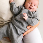 Baby wearing heather grey cashmere sweater