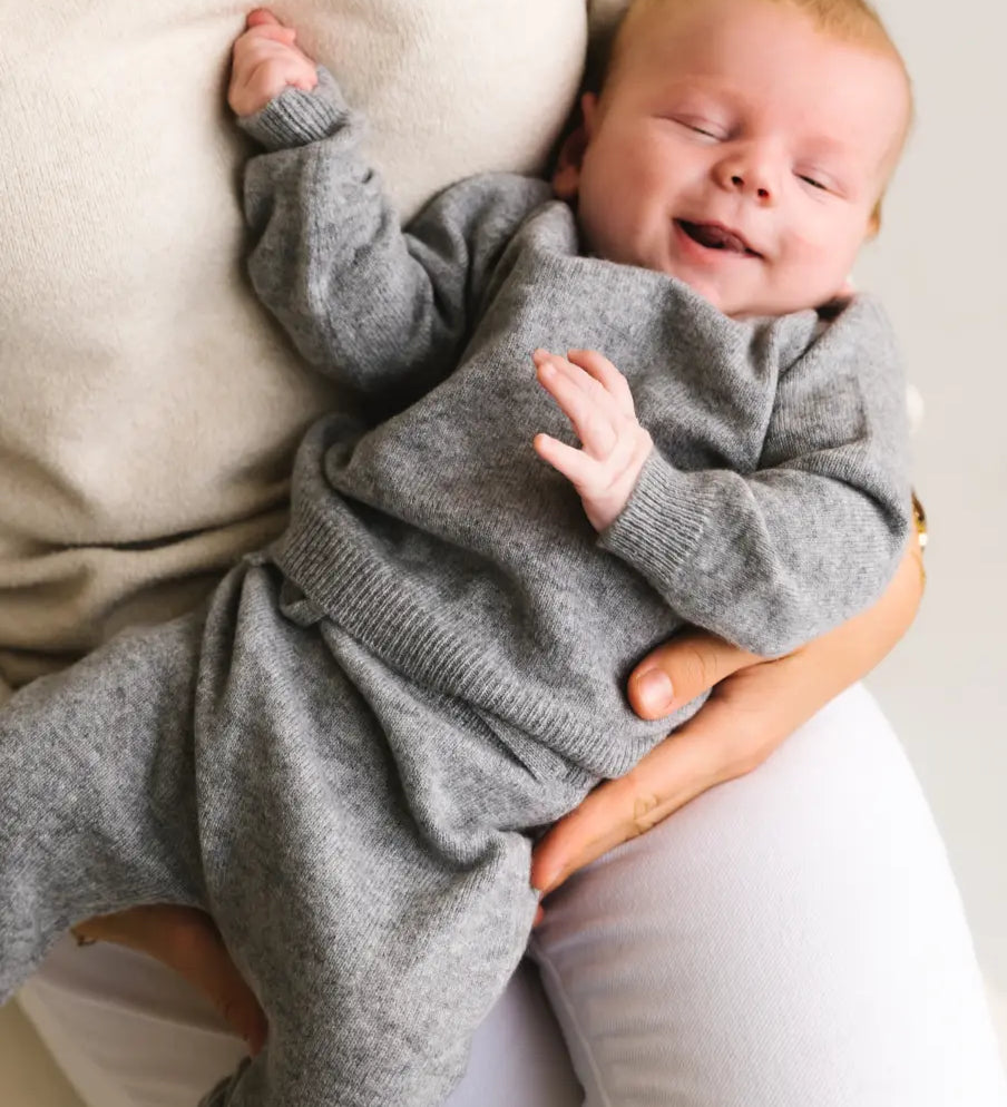 Baby wearing heather grey cashmere sweater